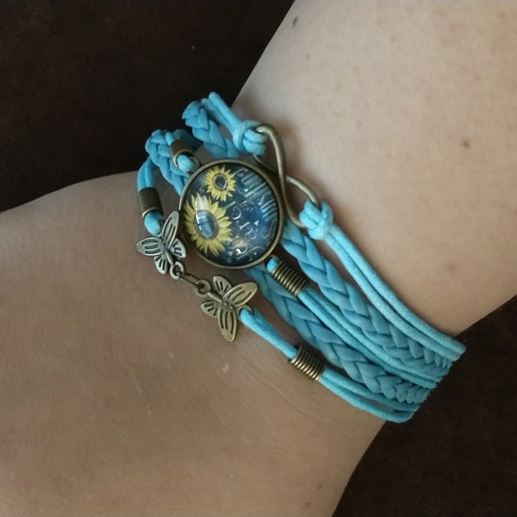 unbranded Jewelry - NWT butterfly, sunflower, infinity symbol braided leather bracelet